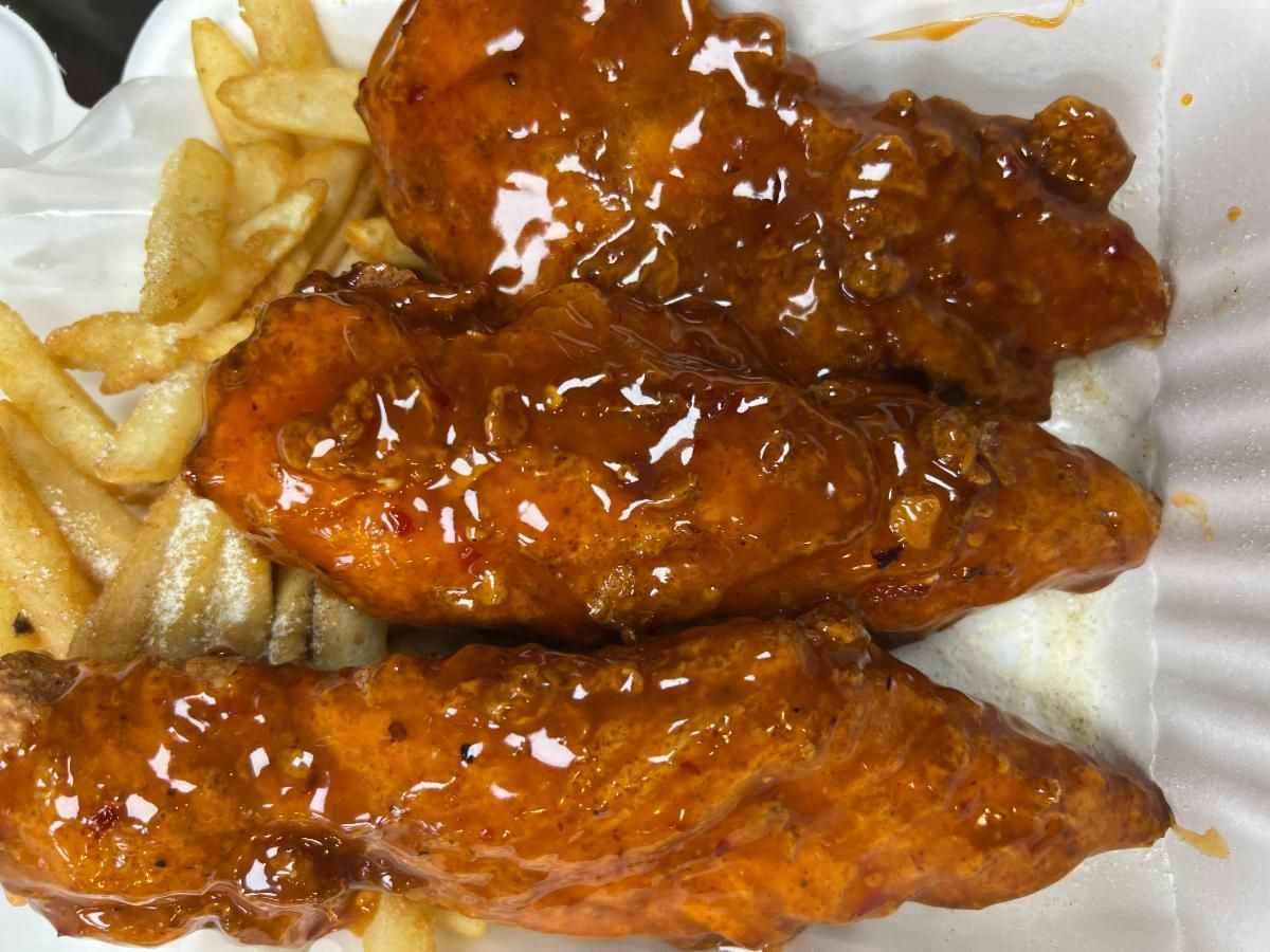 Sauced chicken tenders over fries
