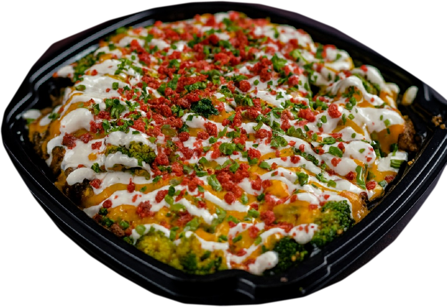 A loaded baked potato topped with cheese, sour cream, chives, bacon bits and broccoli